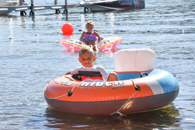 Children enjoying the private beach on a summer day