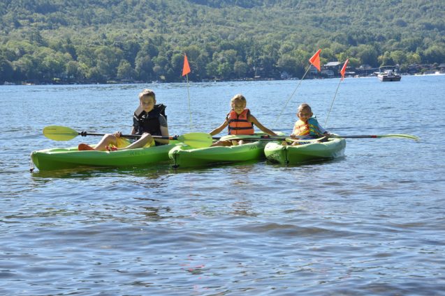 Three green kayaks on Lake George