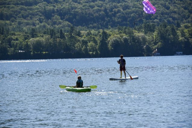 Kayak and paddle boarder on Lake George